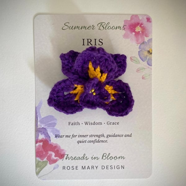 Crocheted Iris brooch on meaning card