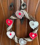Scandi-style Christmas wreath made from crocheted hearts and ribbon - Image 2