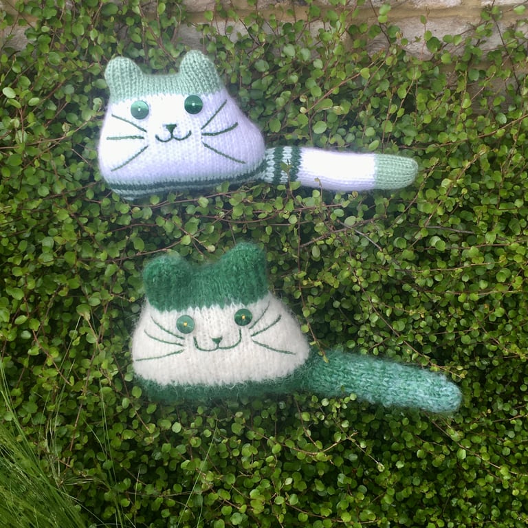 Green hand knitted kitten decoration 