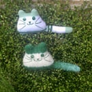 Green hand knitted kitten decoration 