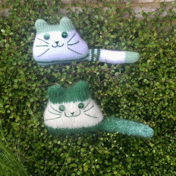 Green hand knitted kitten decoration 