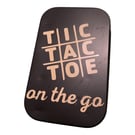 Tic tac toe - on the go. Travel game in a tin