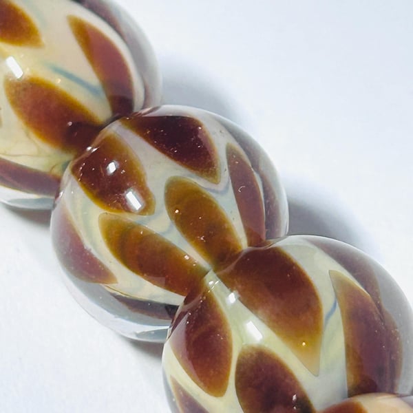 Handmade brown and beige lamp work glass beads
