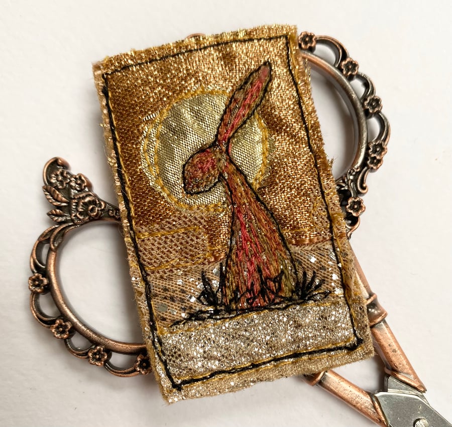 Upcycled harvest hare sunset brooch pin or badge. 