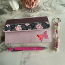 Sleek fold out notebook wallet with accessorised pen and keyring.