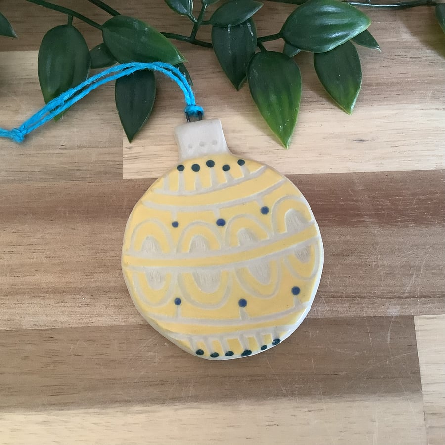 Handmade stoneware yellow Christmas bauble tree decoration 