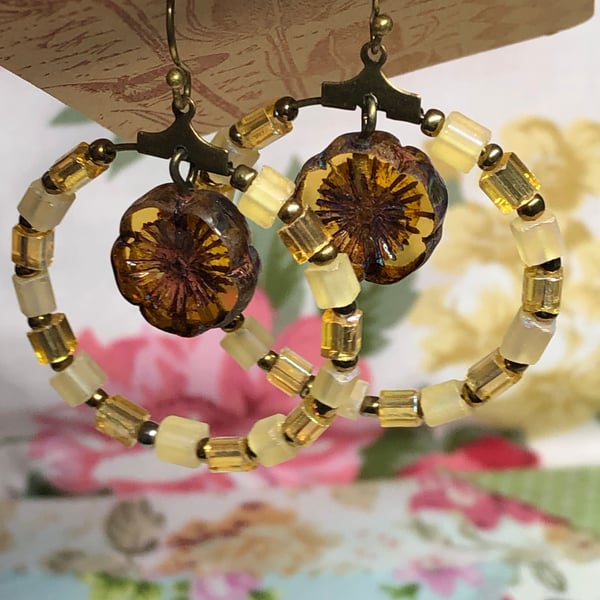 Yellow glass hoop earrings with Amber Czech glass flowers 