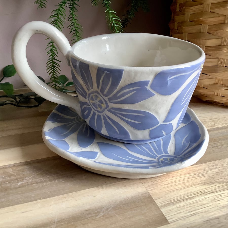 Handmade stoneware lilac flower tea cup and saucer set