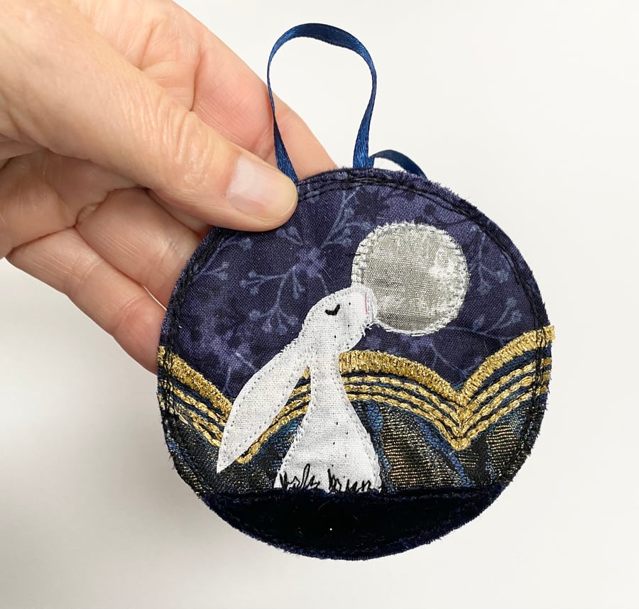 Upcycled embroidered winter hare home decoration. 