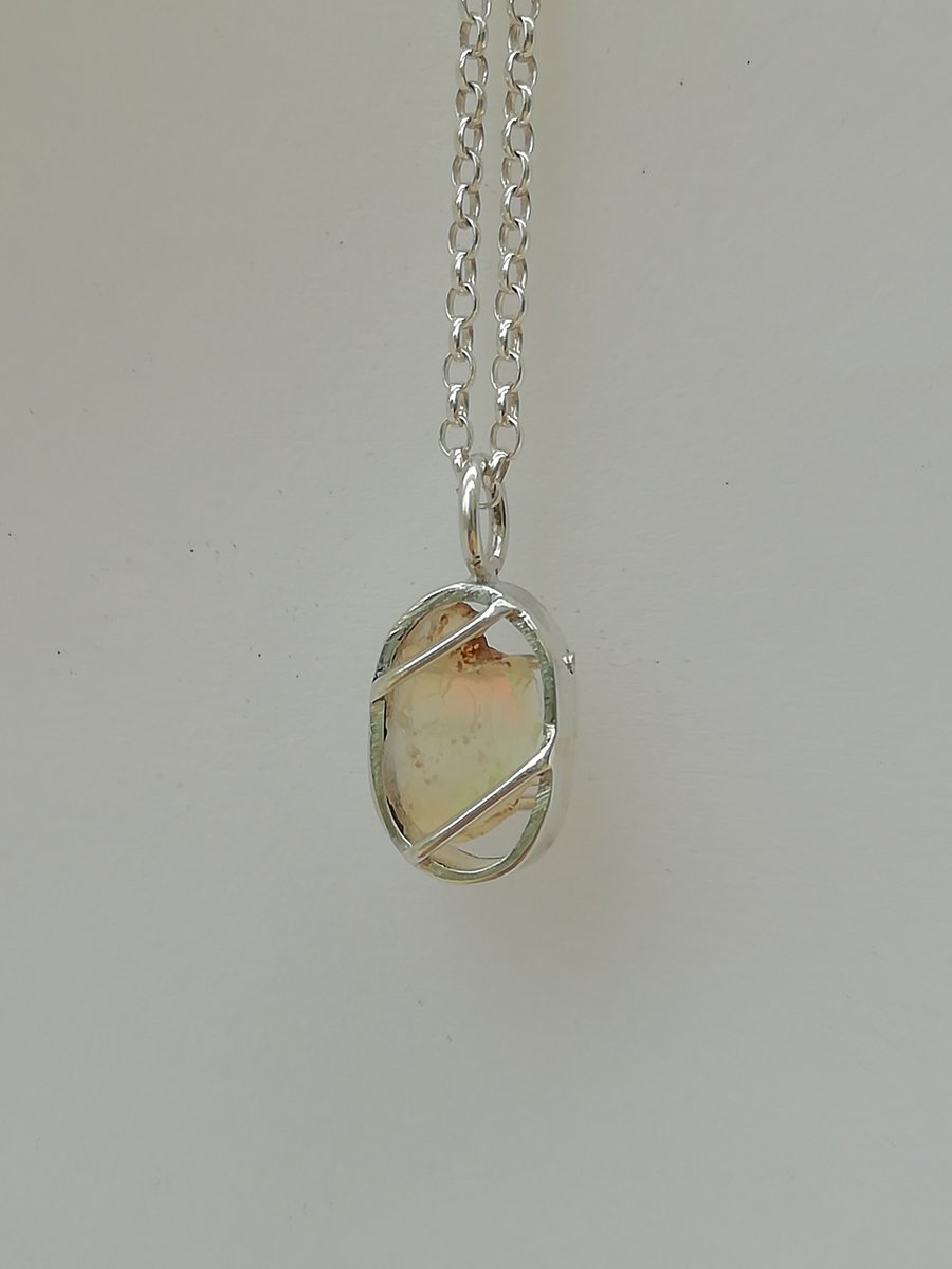 Tiny Oval Cage with a Raw Opal