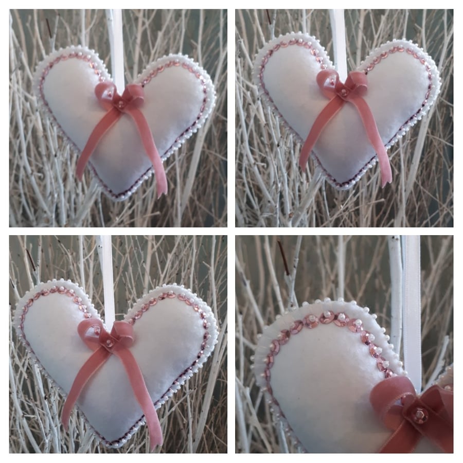 Heart hanger in white felt with pink metallic sequins. 