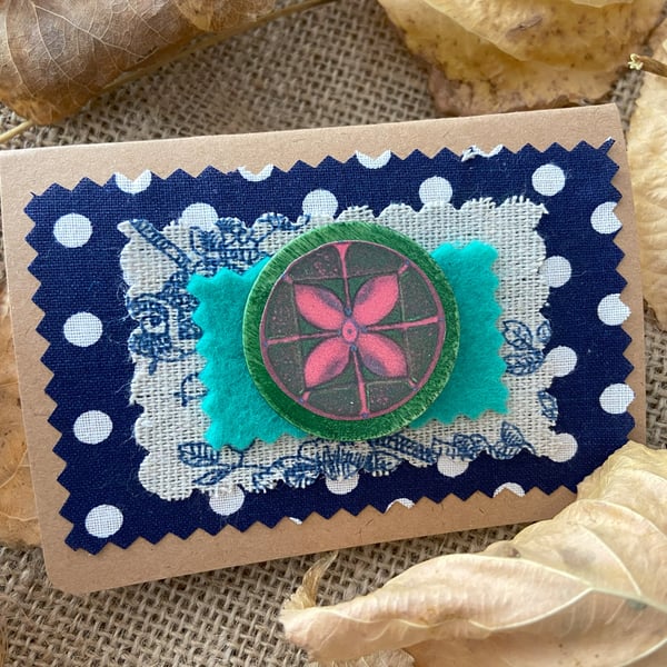 Handcrafted brooch with four leaf petal in red and green
