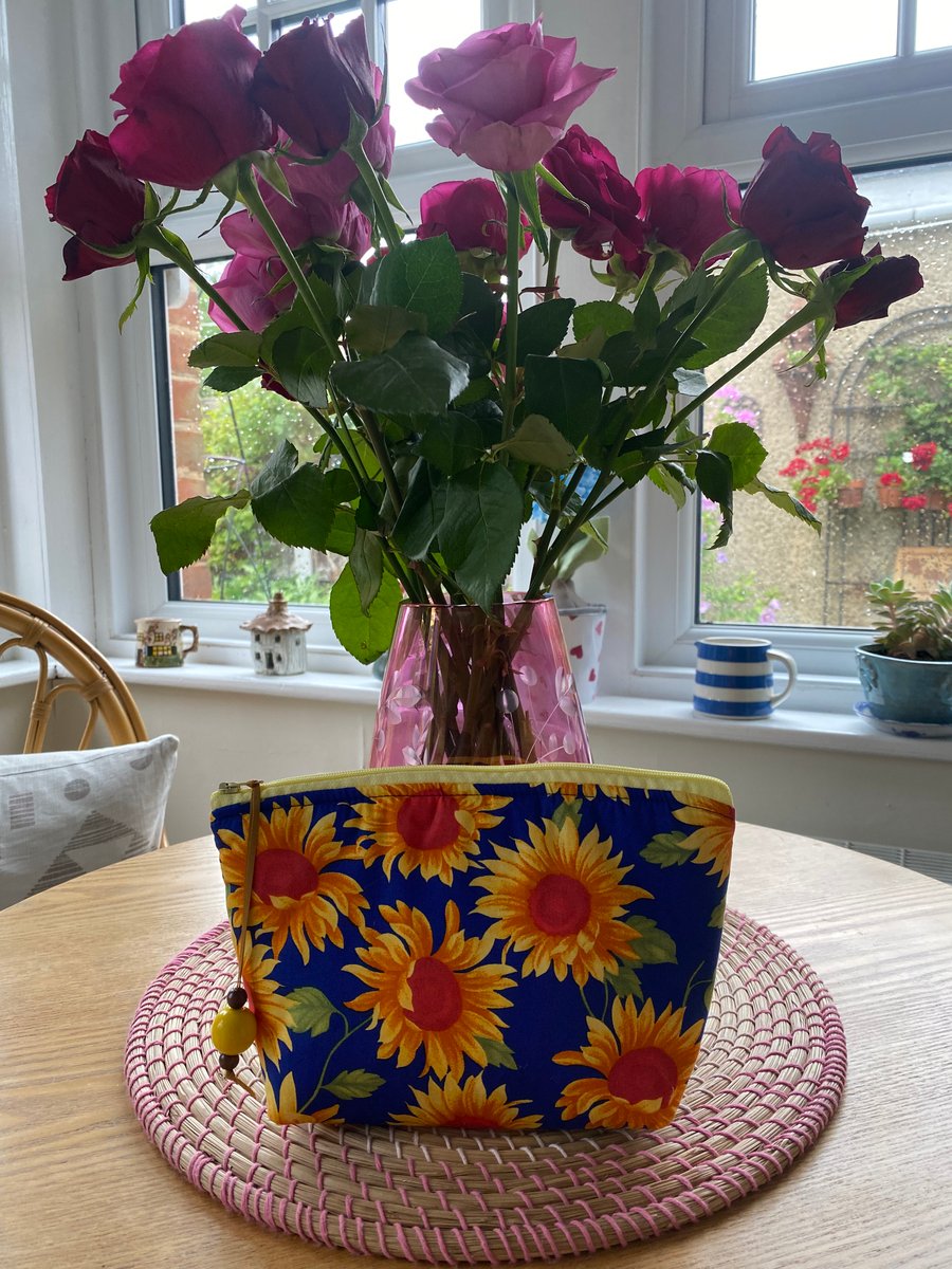 Handmade zipped clutch or purse in vibrant sunflower fabric