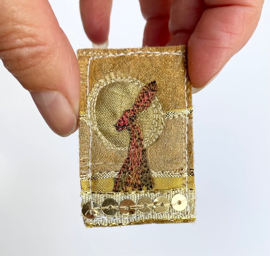 Upcycled harvest hare sunset brooch pin or badge. 