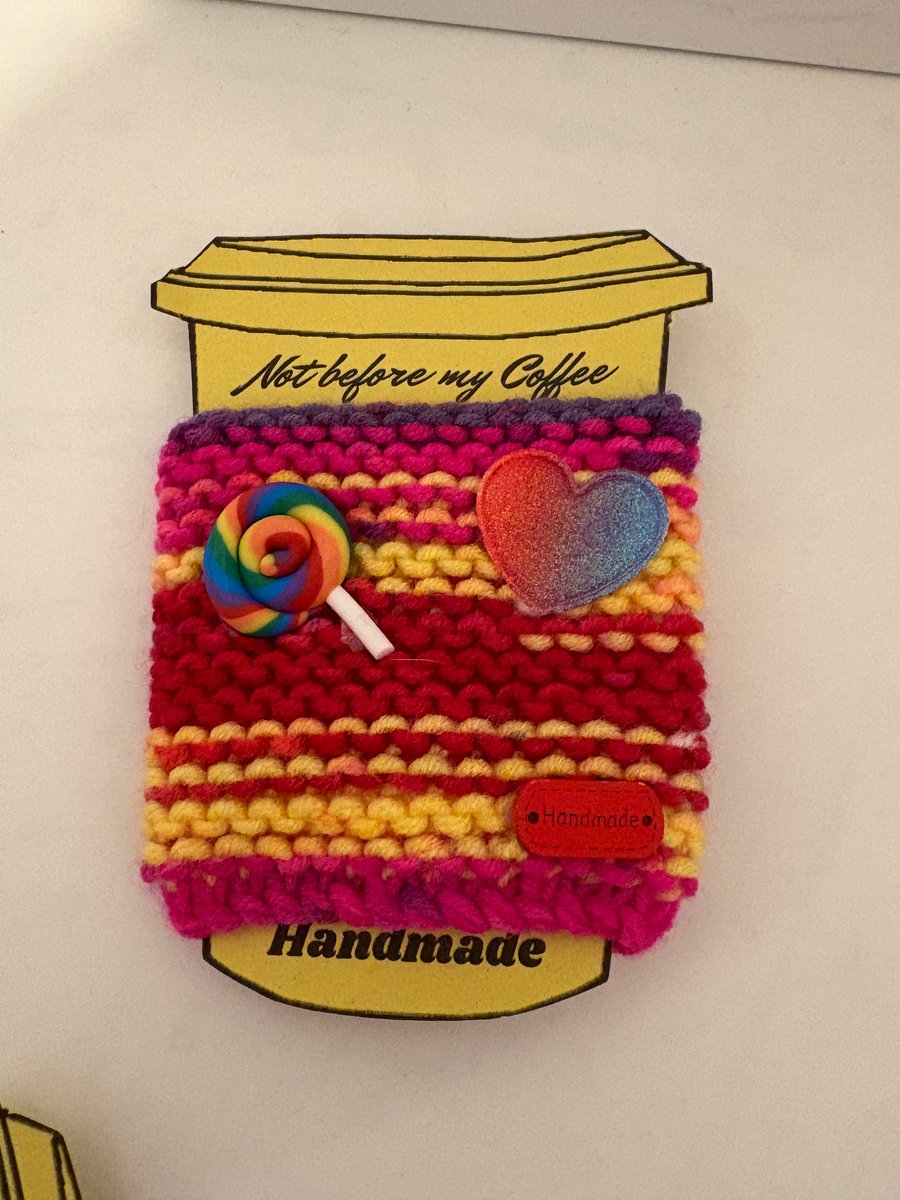 Lollipop and heart knitted cup cosy. 