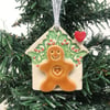 Ceramic gingerbread house decoration with Holly roof