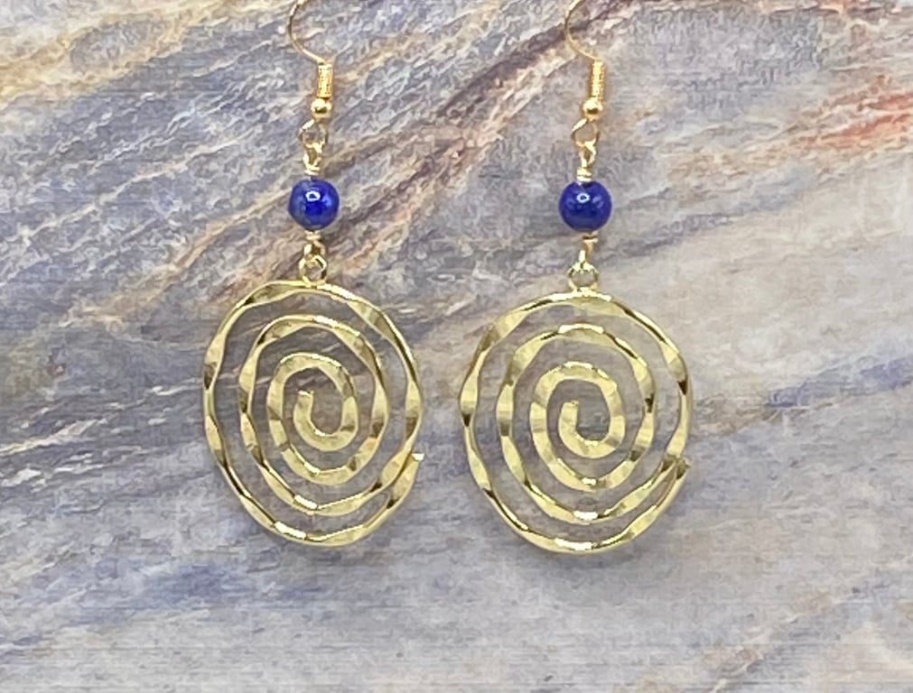 Gold tone spiral charm earrings with lapis lazuli stones