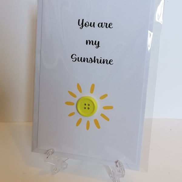 "You are my sunshine" greetings card with a yellow button sun