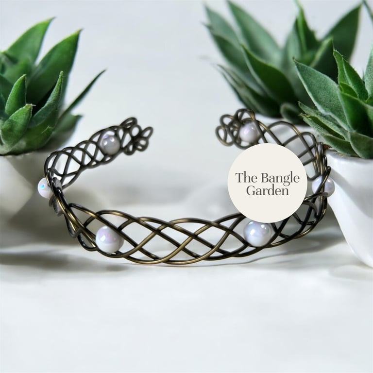 Handmade wire woven antique bronze and opal coloured bead bangle