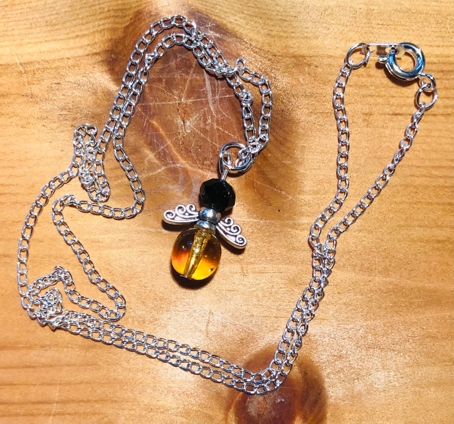 Glass hot sale bee necklace