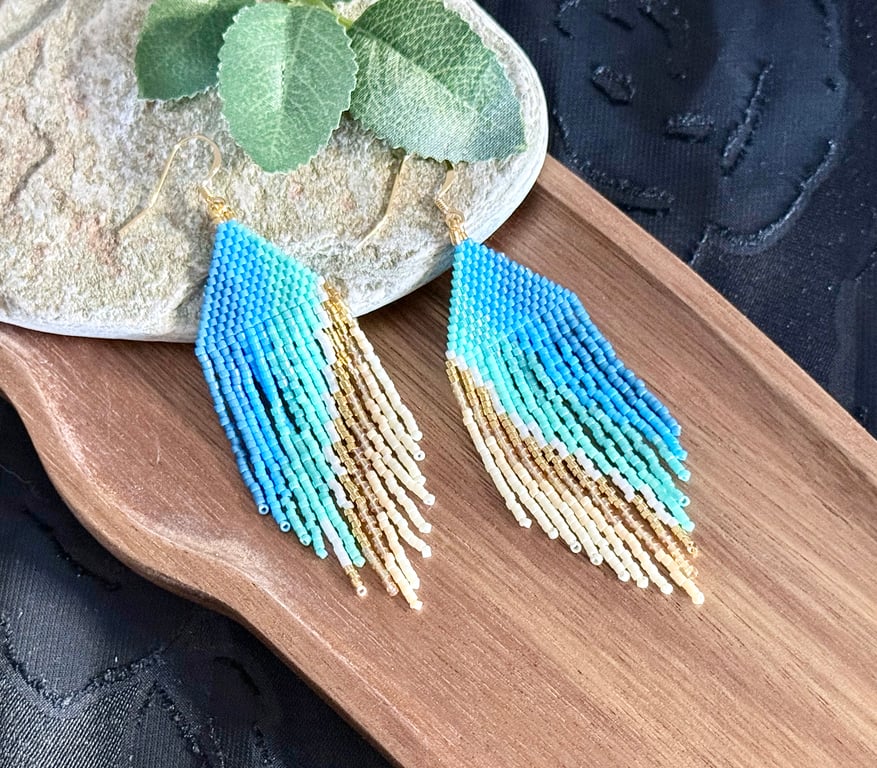 Beadwork fringe earrings in ocean blue and golden sand tones