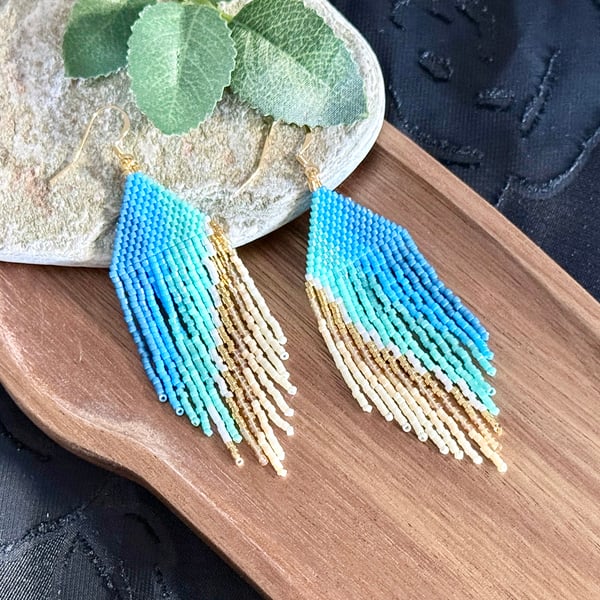 Beadwork fringe earrings in ocean blue and golden sand tones
