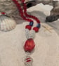 Red Bamboo Coral Pendant complimented by wire wrapped beads - Image 1