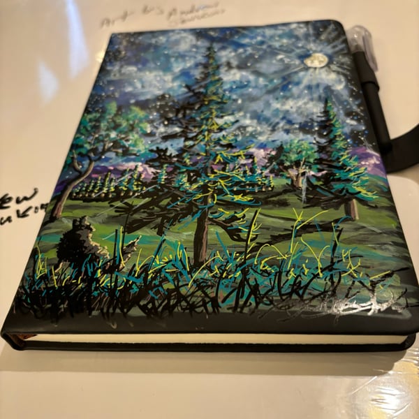 A hand painted and sealed faux leather journal by Andrew Jenkins 