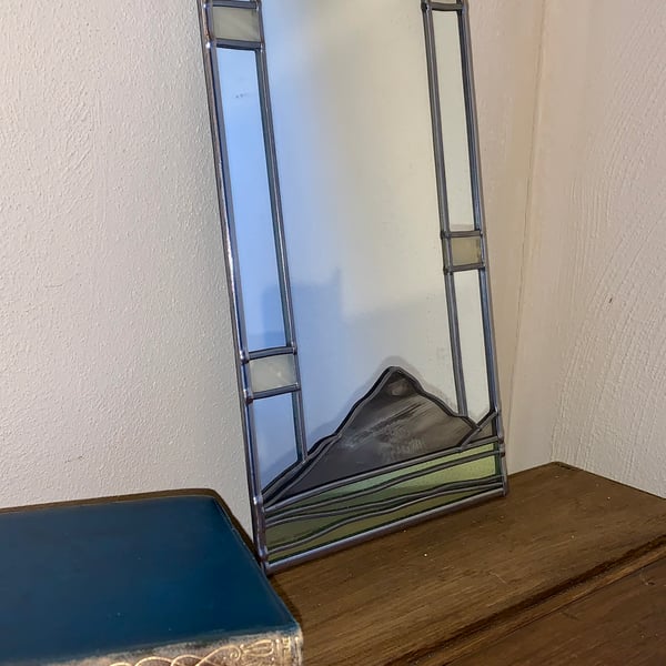 Decorative mirror inspired by the Buachaille Etive Mor mountain .