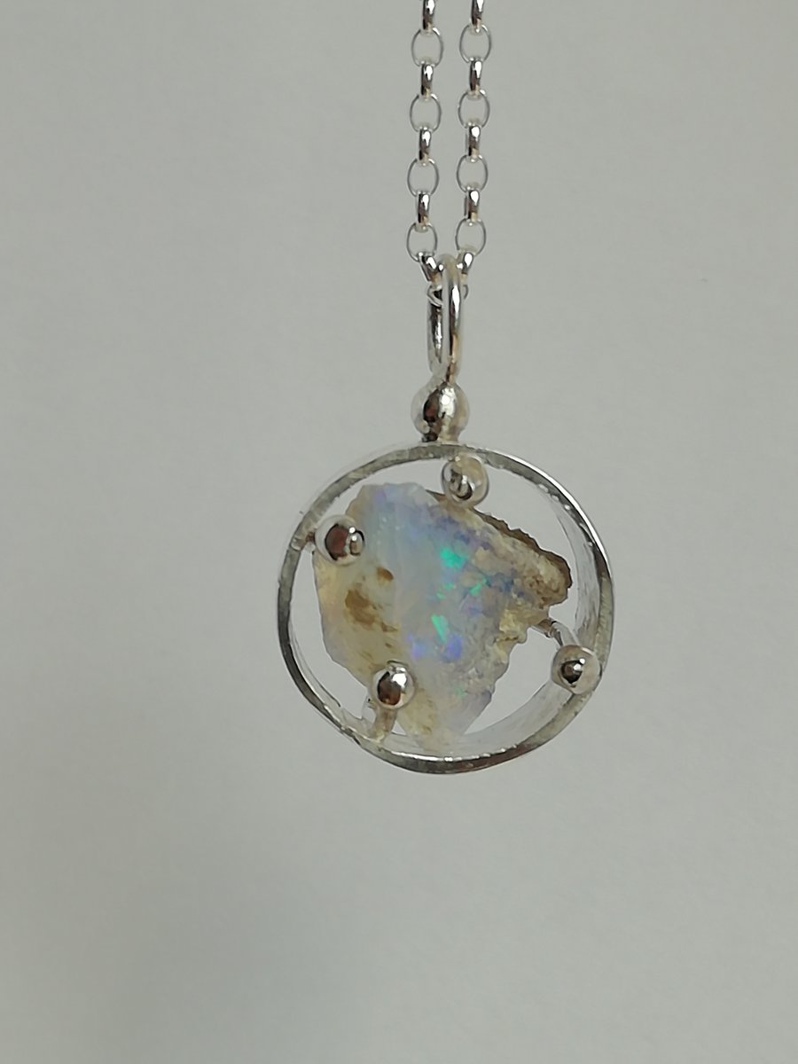 Pale Blue Opal in a Round Cage