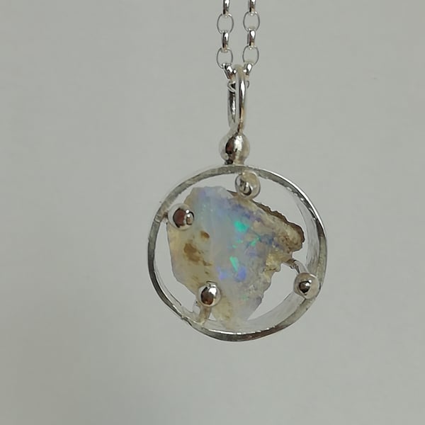 Pale Blue Opal in a Round Cage