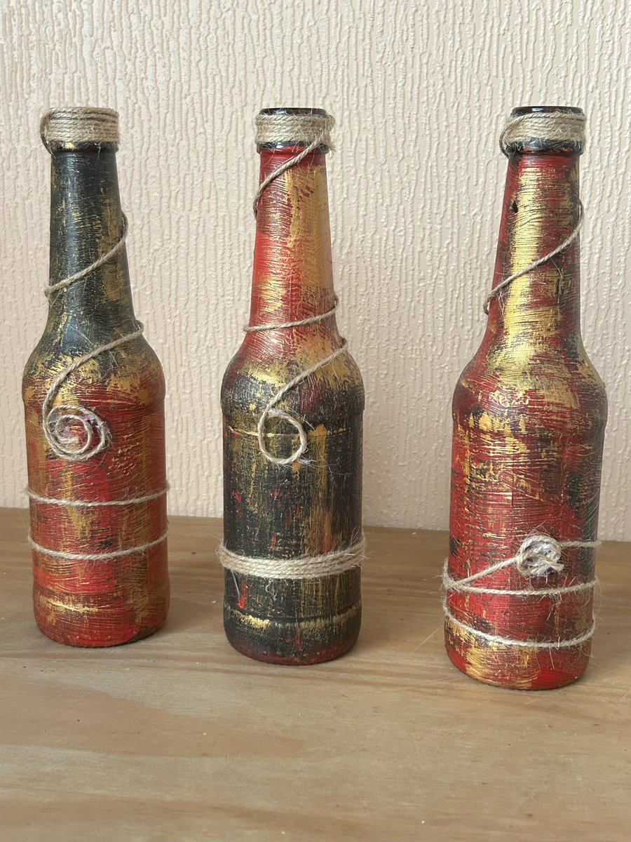 Decorative bottle set, upcycled beer bottles painted in tones of red and gold