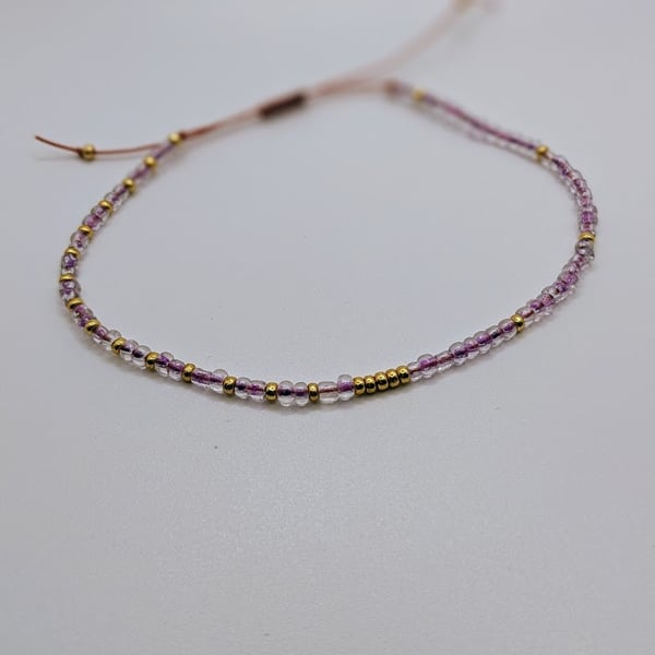 Delicate tiny clear purple glass seed bead adjustable bracelet