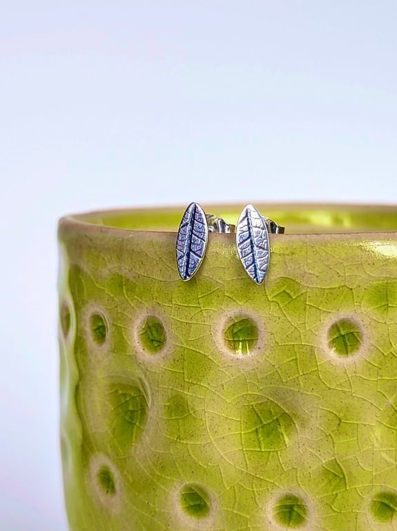 Mini leaf sterling silver stud earrings with leaf printed detail
