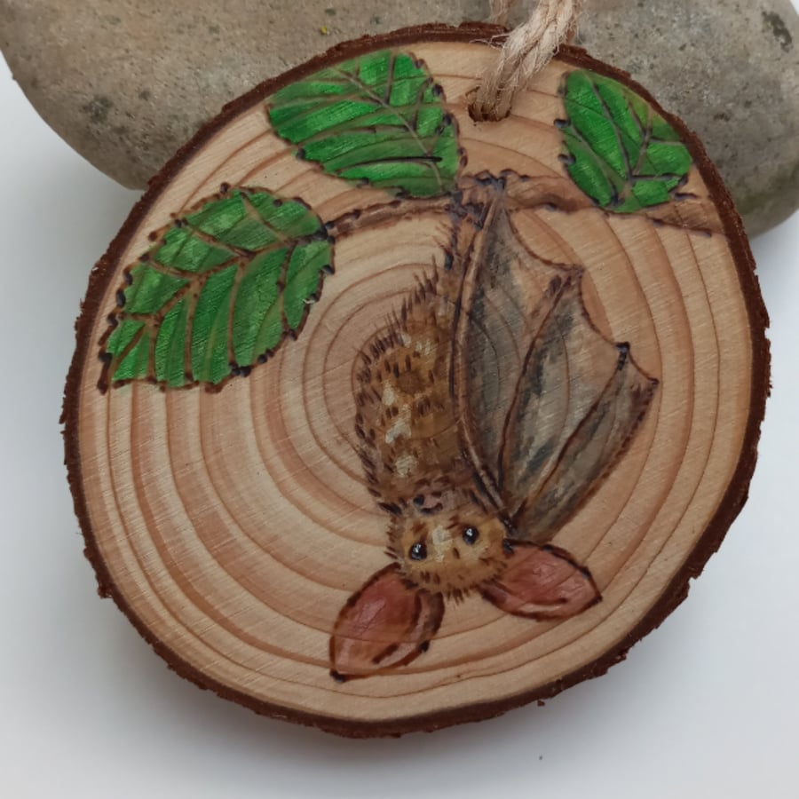 Pyrography log slice bat talisman 