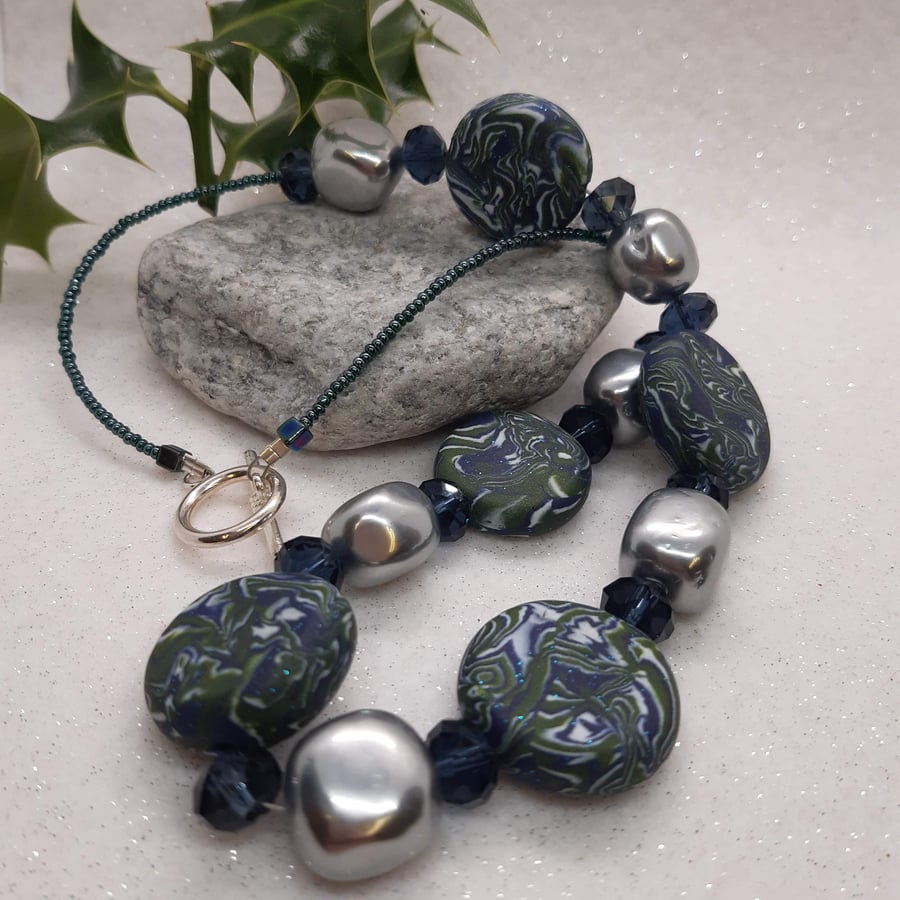 Distinctive disc shaped polymer clay necklace