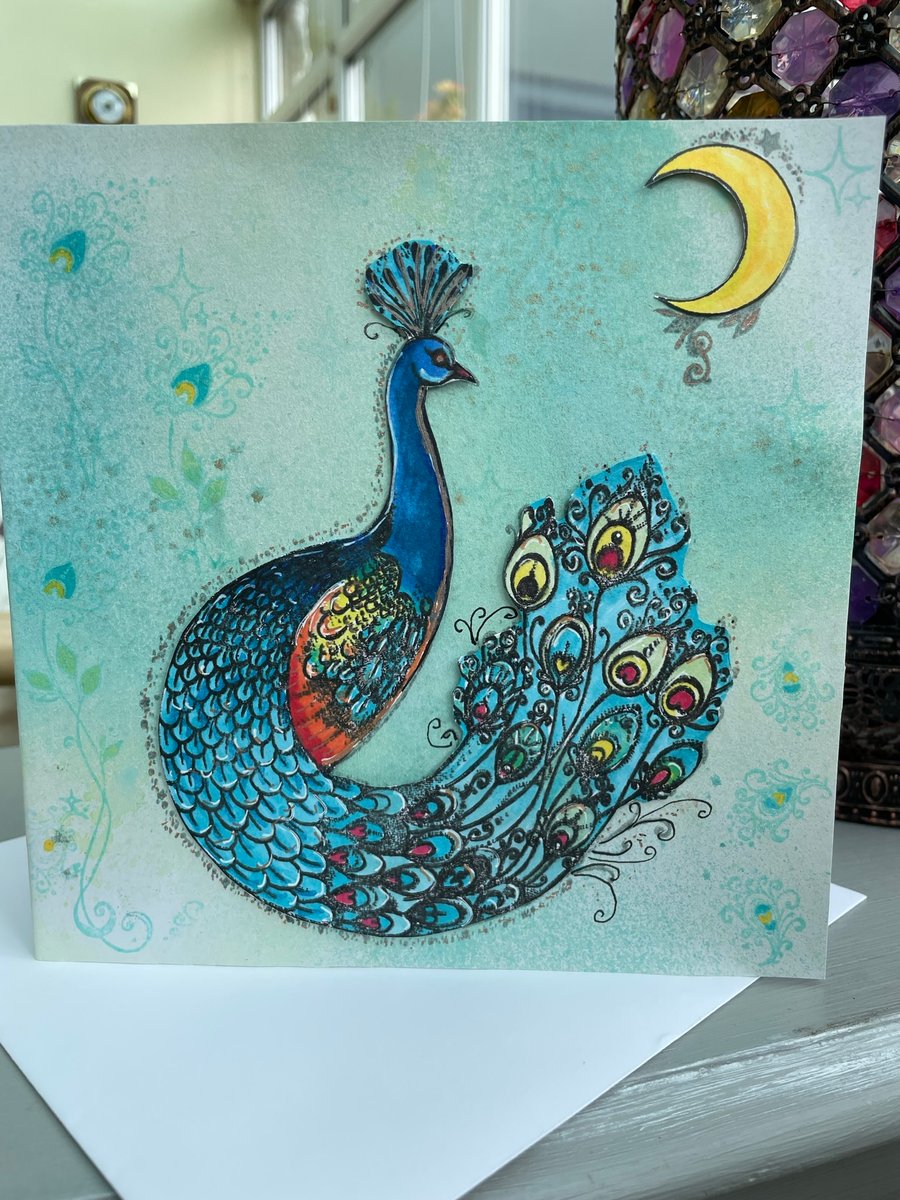 Peacock under a crescent moon luxury greetings card