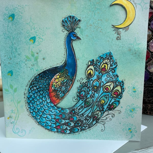 Peacock under a crescent moon luxury greetings card