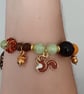 Elasticated beaded red squirrel, tree of life and gold acorn charm bracelet  - Image 6