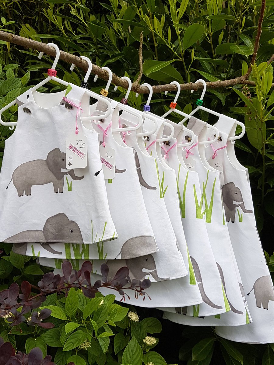 Age: 3-4y. White and grey elephant cotton dress. 