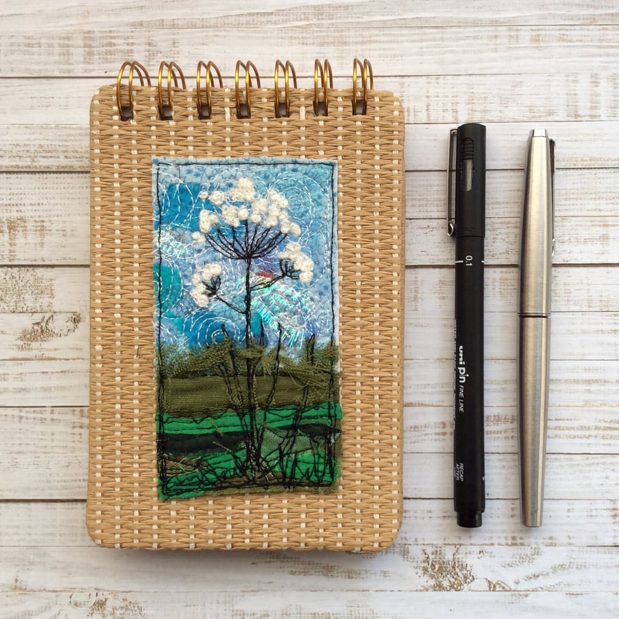 Embroidered wild flower raffia reporters notepad. 