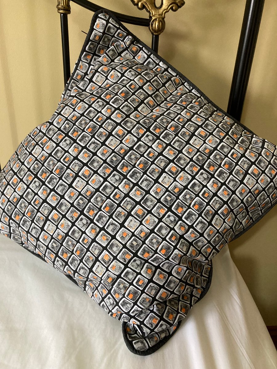 A pair of large square cushion covers.  Would look striking in the living room.