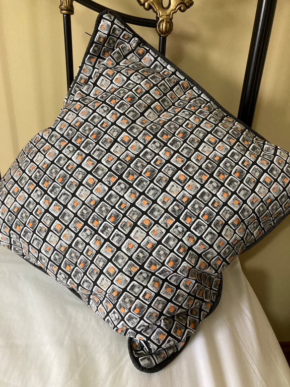 A pair of large square cushion covers.  Would look striking in the living room.