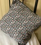 A pair of grey black and orange combo piped cushion covers. Zipped on one side. - Image 1