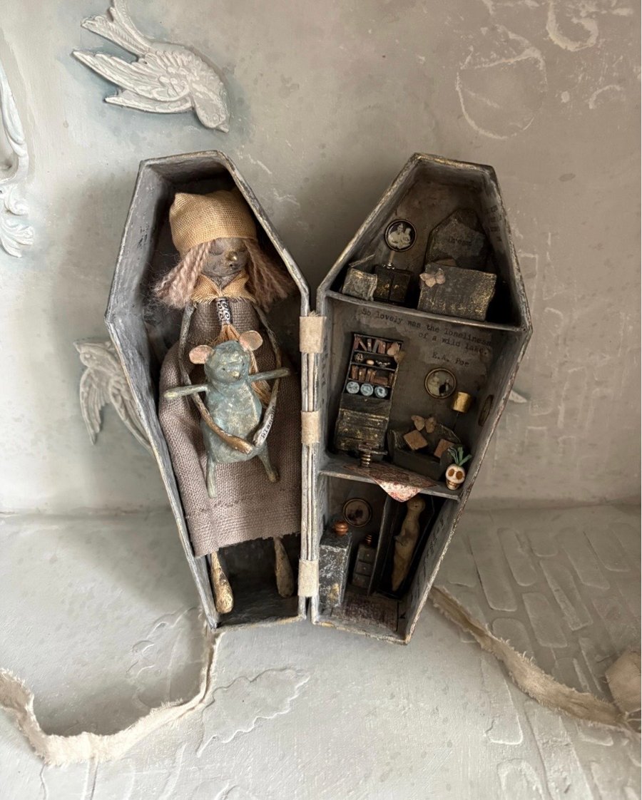 Paper mache doll in a handmade box