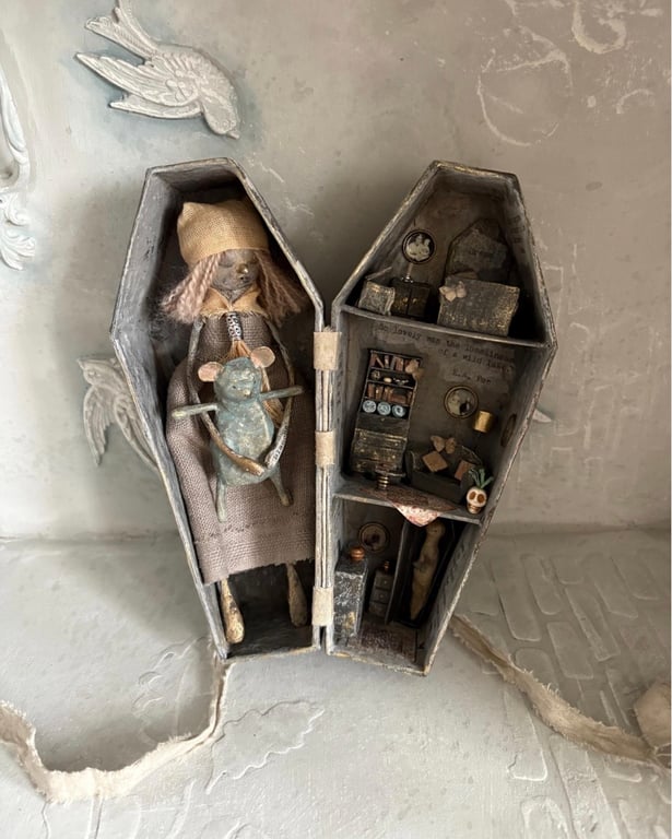 Paper mache doll in a handmade box