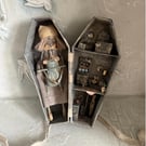 Paper mache doll in a handmade box