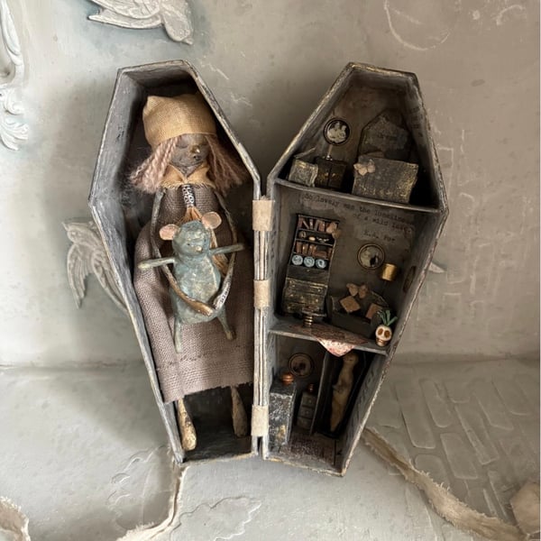 Paper mache doll in a handmade box