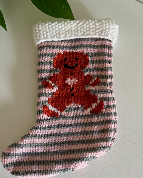 Hand knitted  pink gingerbread man  christmas stocking