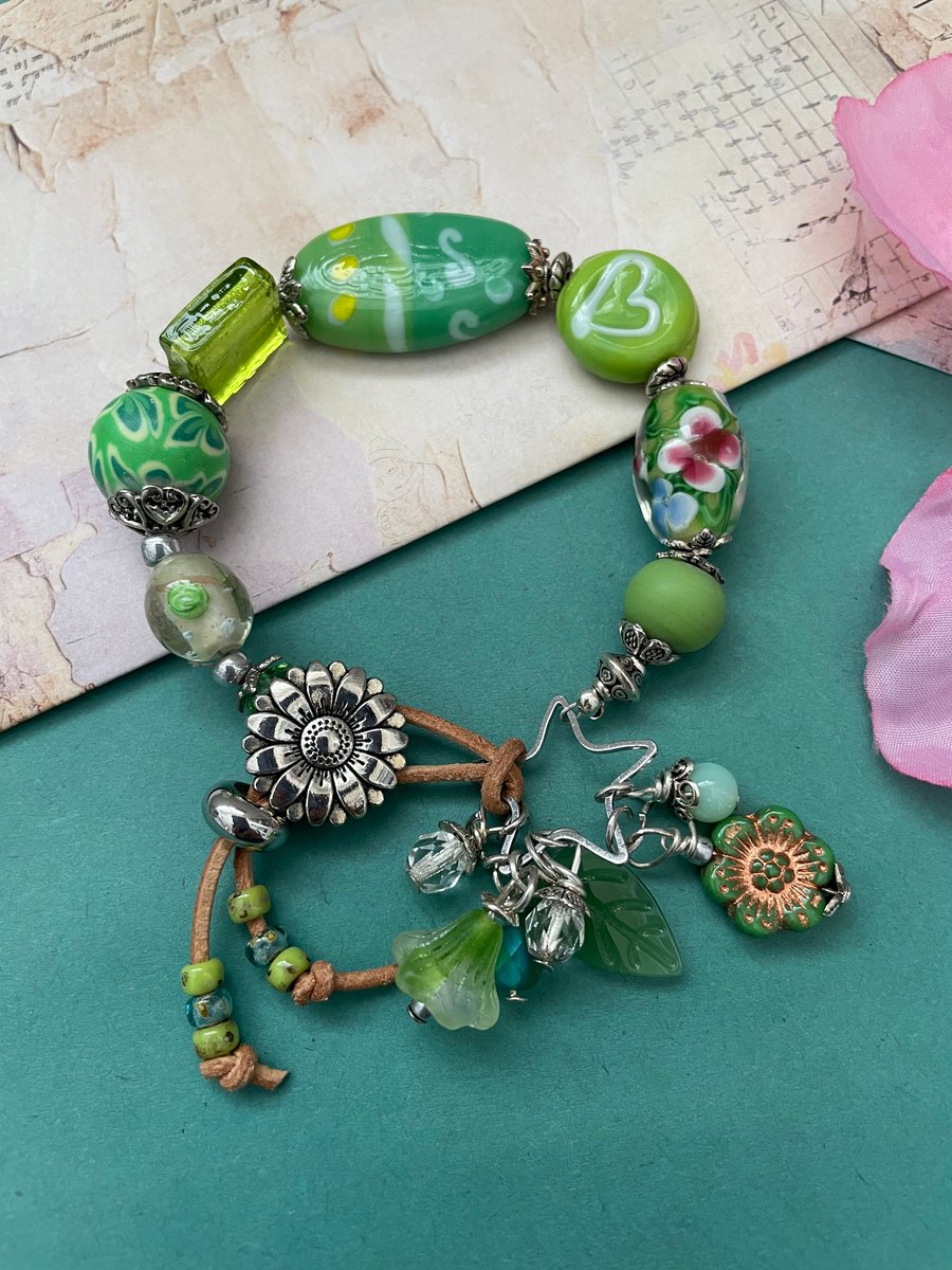 Bracelet Lamp work glass beaded and gemstone adjustable charm bracelet. 